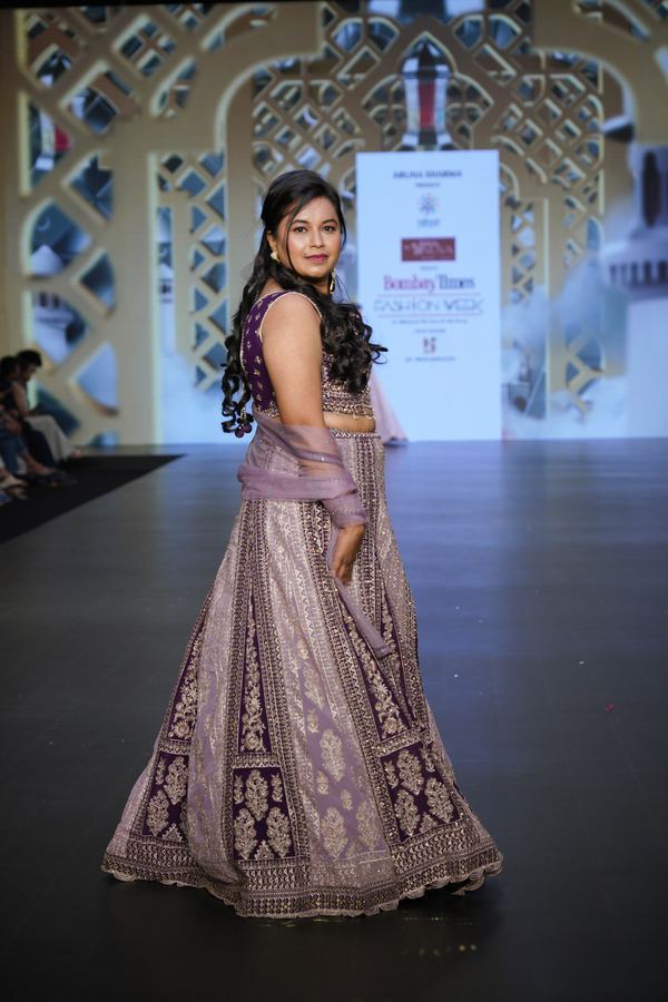 Participants dressed elegantly posing together at the event